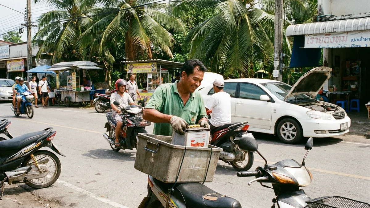 Battery Fast Phuket technician delivering and fitting a car battery at roadside